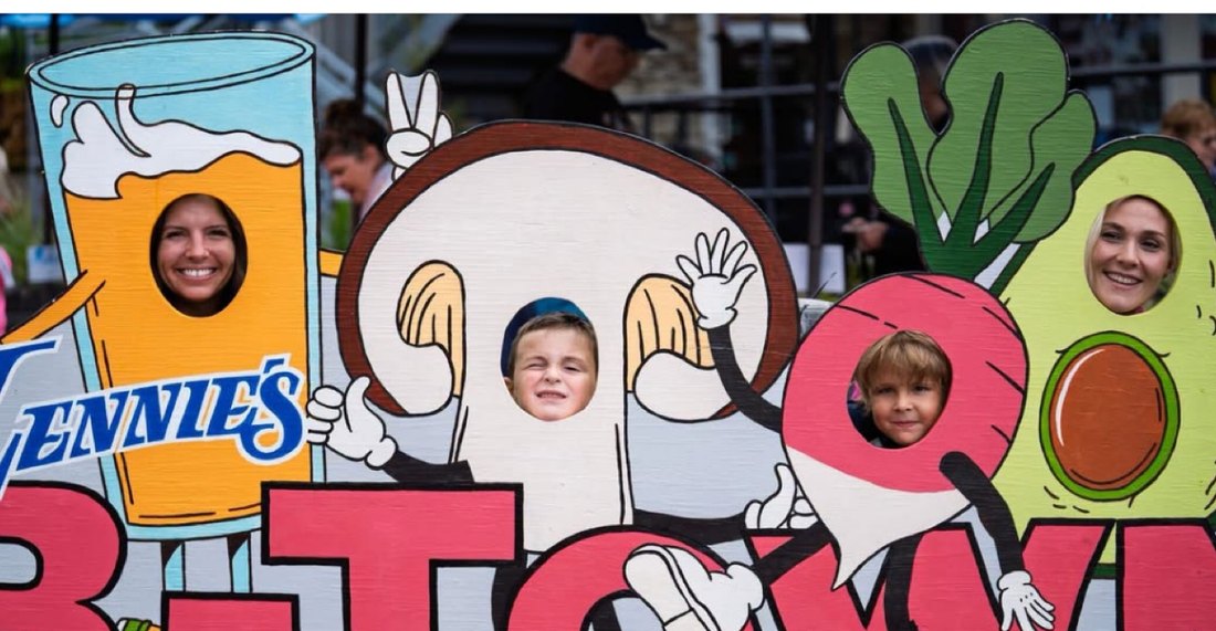 Lavinia Chudy at a B-Town photo-op board at Taste of Bloomington 2026