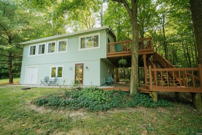 Home at 8310 N Low Gap Rd, Unionville, Indiana, nestled among trees
